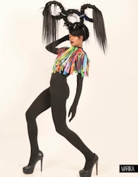 a woman in a colorful costume posing for a photo